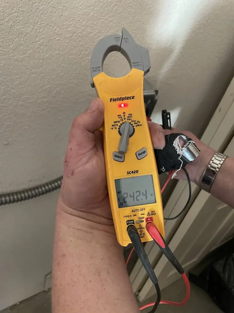Voltage testing with clamp meter during Ceiling Fan Installation in Mukwonago